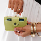 Sugar Snap | Model holding compact wallet with snap closure and zippered pouch