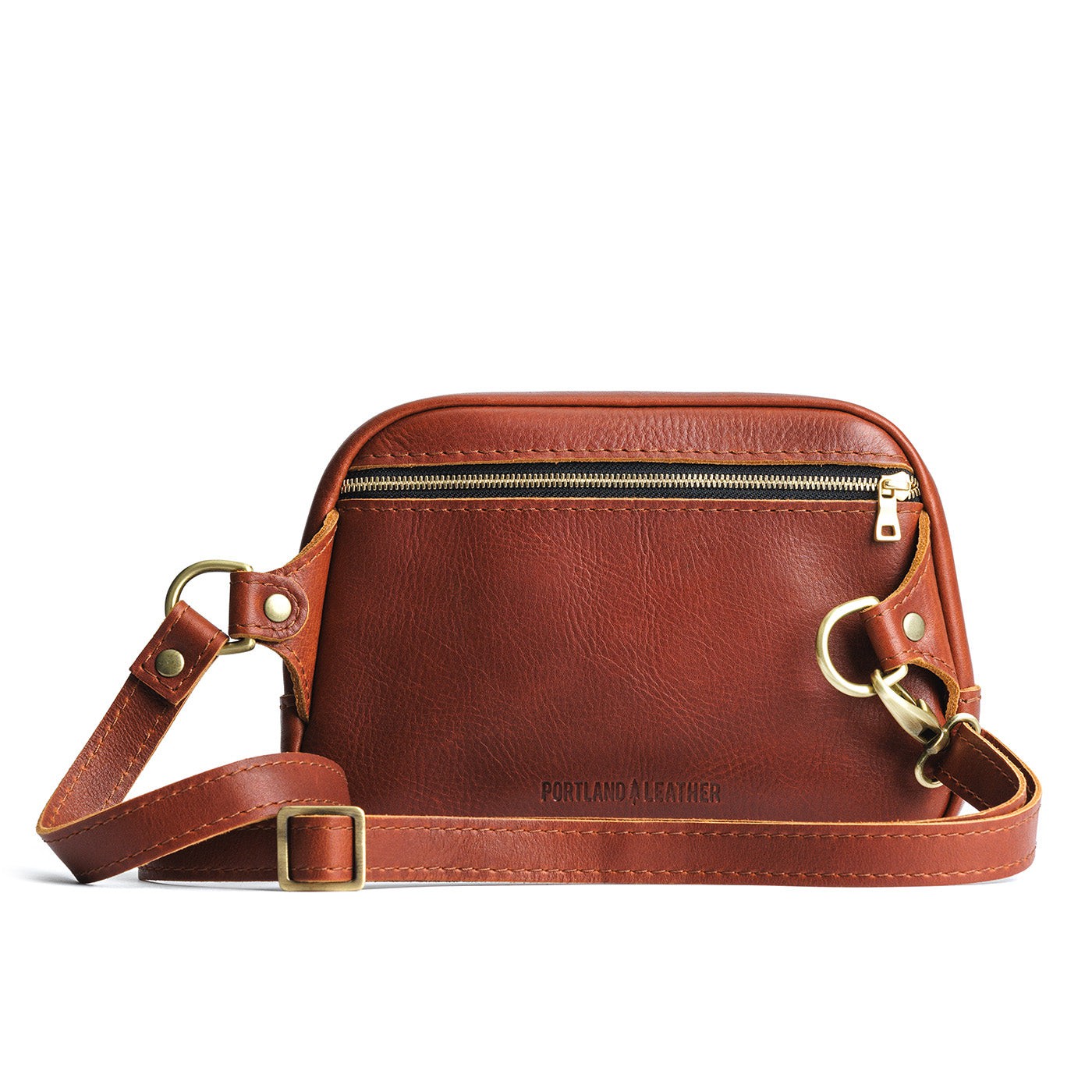 Chestnut  | Back of rectangular sling bag with zipper pocket