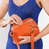 Cape Coral | Model using sling bag back zipper