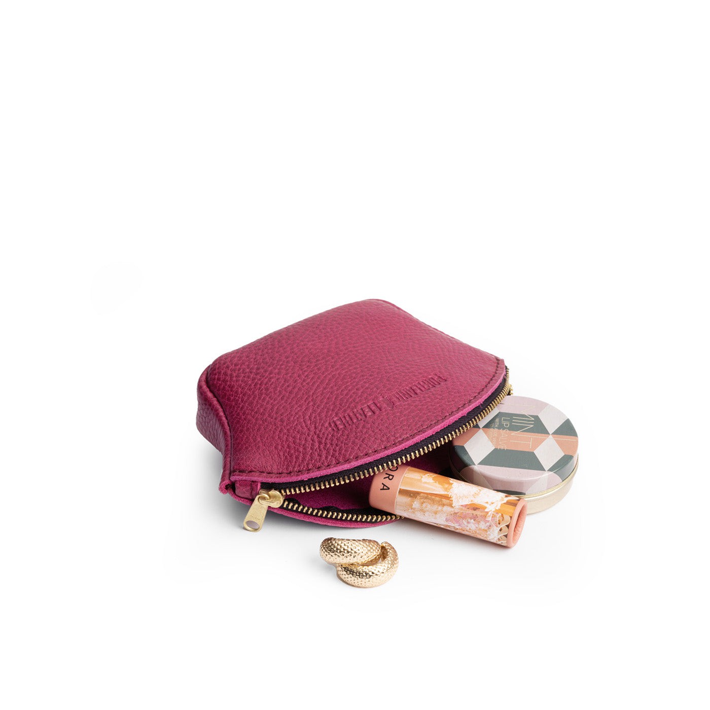 Cosmo*Small | Seashell shaped leather makeup bag with curved top zipper open and flat bottom