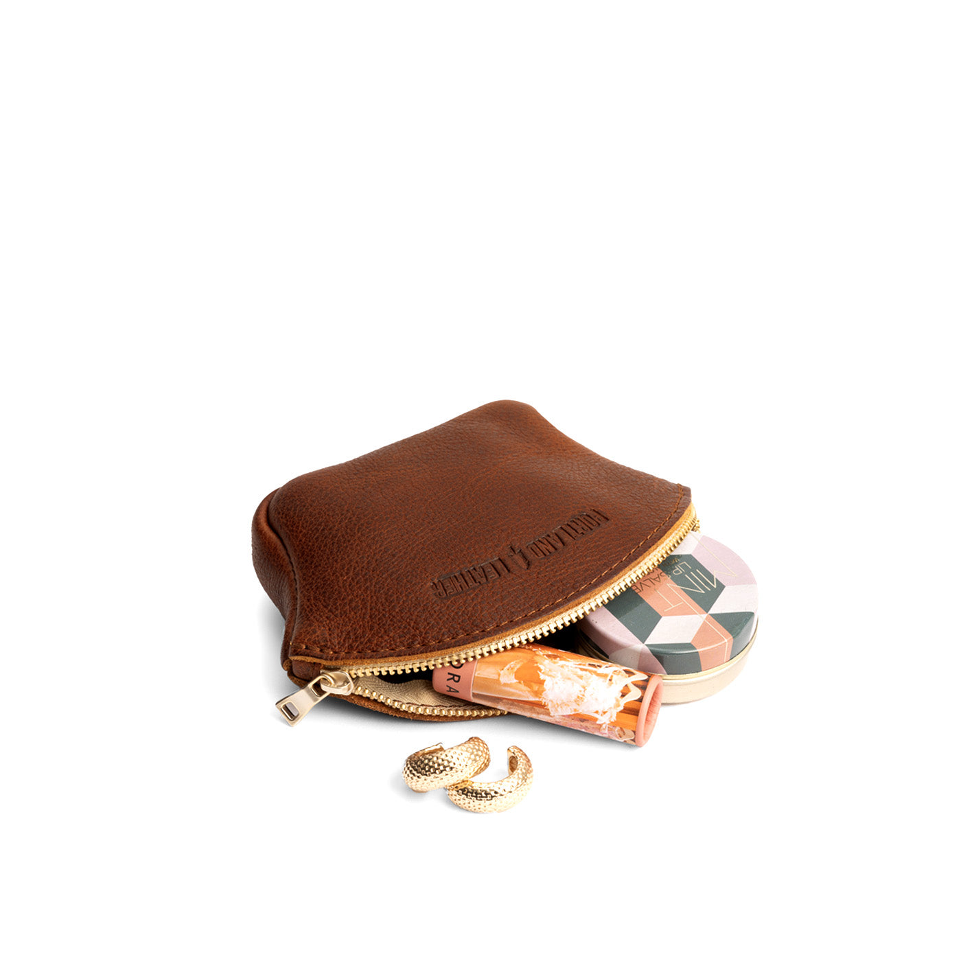 Nutmeg*Small | Seashell shaped leather makeup bag with curved top zipper open and flat bottom