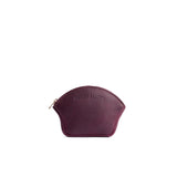 Plum Small | Seashell shaped leather makeup bag with curved top zipper and flat bottom