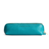 Baja | Leather pouch with curved seams and top zipper