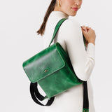 Cowboy Mint | Model wearing rectangular backpack with leather lined nylon straps and magnetic flap closure