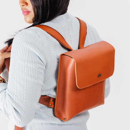 Tuscany | Rectangular backpack with leather lined nylon straps and magnetic flap closure