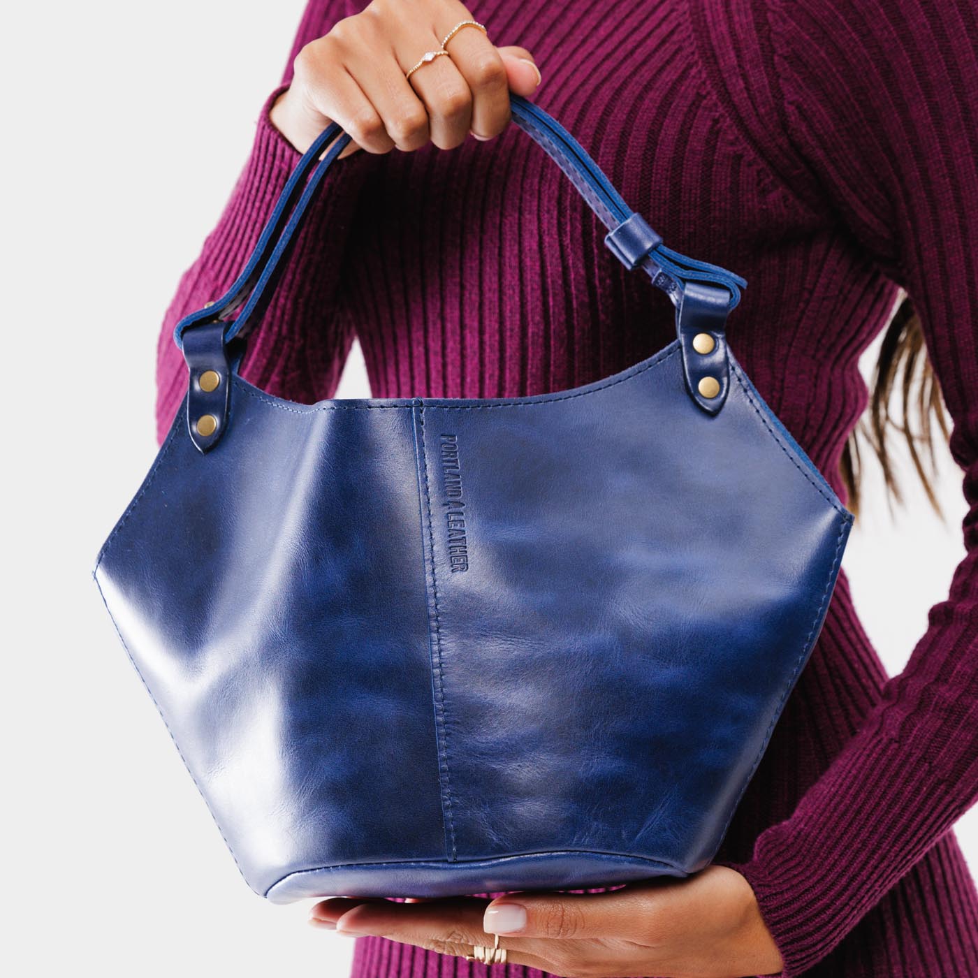 Cowboy Blue*Small | Structured bucket shaped handbag with an adjustable shoulder strap