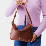 Nutmeg Small | Petite slouchy leather shoulder bag with zipper opening and three metal tree emblems