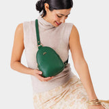 Bacalar | Model wearing small sling bag with zipper closure and adjustable strap