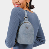 Fog | Model wearing small sling bag with zipper closure and adjustable strap