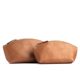 Hava | Spacious leather makeup bag with curved seams and top zipper