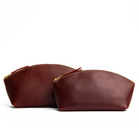 Cognac | Spacious leather makeup bag with curved seams and top zipper
