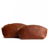 Nutmeg | Spacious leather makeup bag with curved seams and top zipper