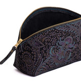 Masquerade | Spacious leather makeup bag with curved seams and top zipper