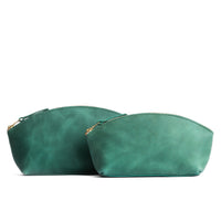 Surf | Spacious leather makeup bag with curved seams and top zipper