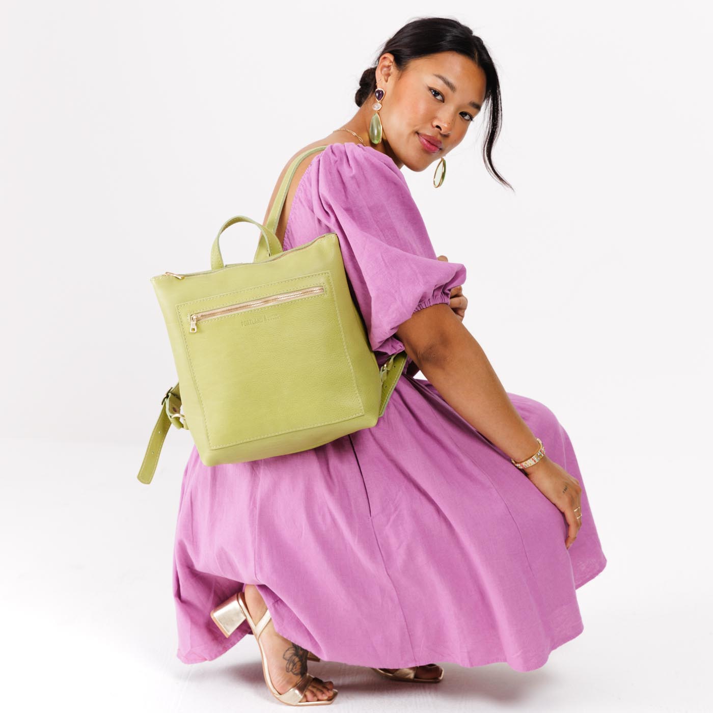 Sugar Snap | Model wearing square slim leather tote backpack