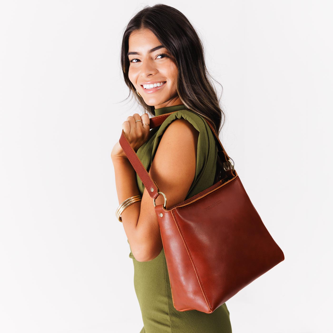 Chestnut | Triangular shoulder bag with antiqued brass finished hardware