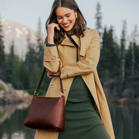 Cognac | Triangular shoulder bag with antiqued brass finished hardware