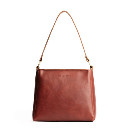 Chestnut | Triangular shoulder bag with antiqued brass finished hardware