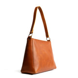 Honey | Triangular shoulder bag with antiqued brass finished hardware