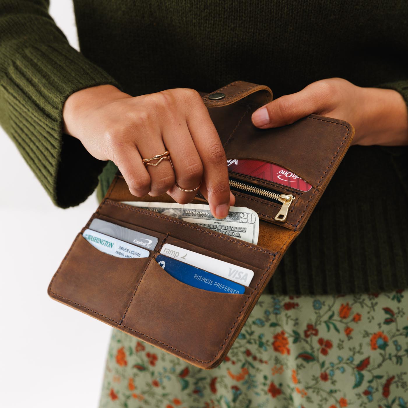 Canyon | Model holding leather wallet with snap open