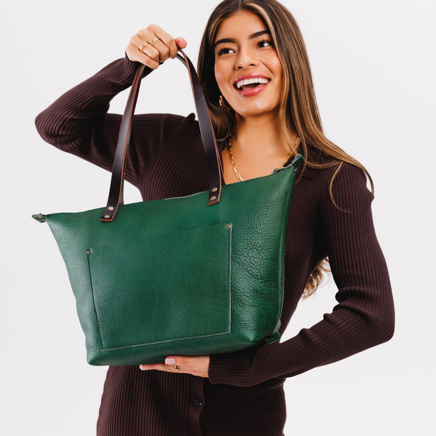 Bacalar*Zipper | Model holding large zipper leather tote bag with sturdy bridle handles and front pocket