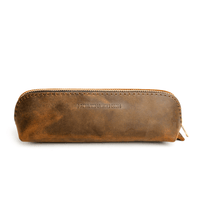 All Color: Canyon | Leather pouch with curved seams and top zipper