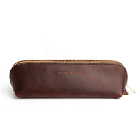 All Color: Cognac | Leather pouch with curved seams and top zipper
